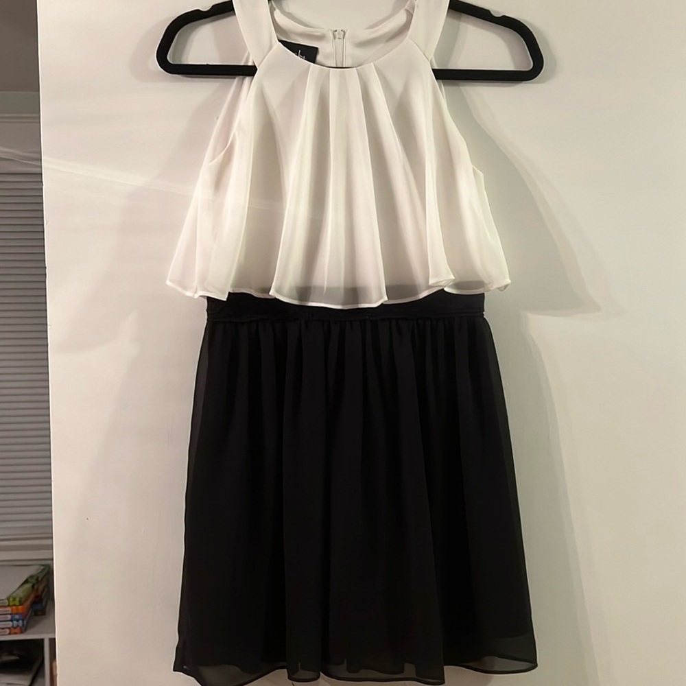 Tank dress with sheer overlay top.